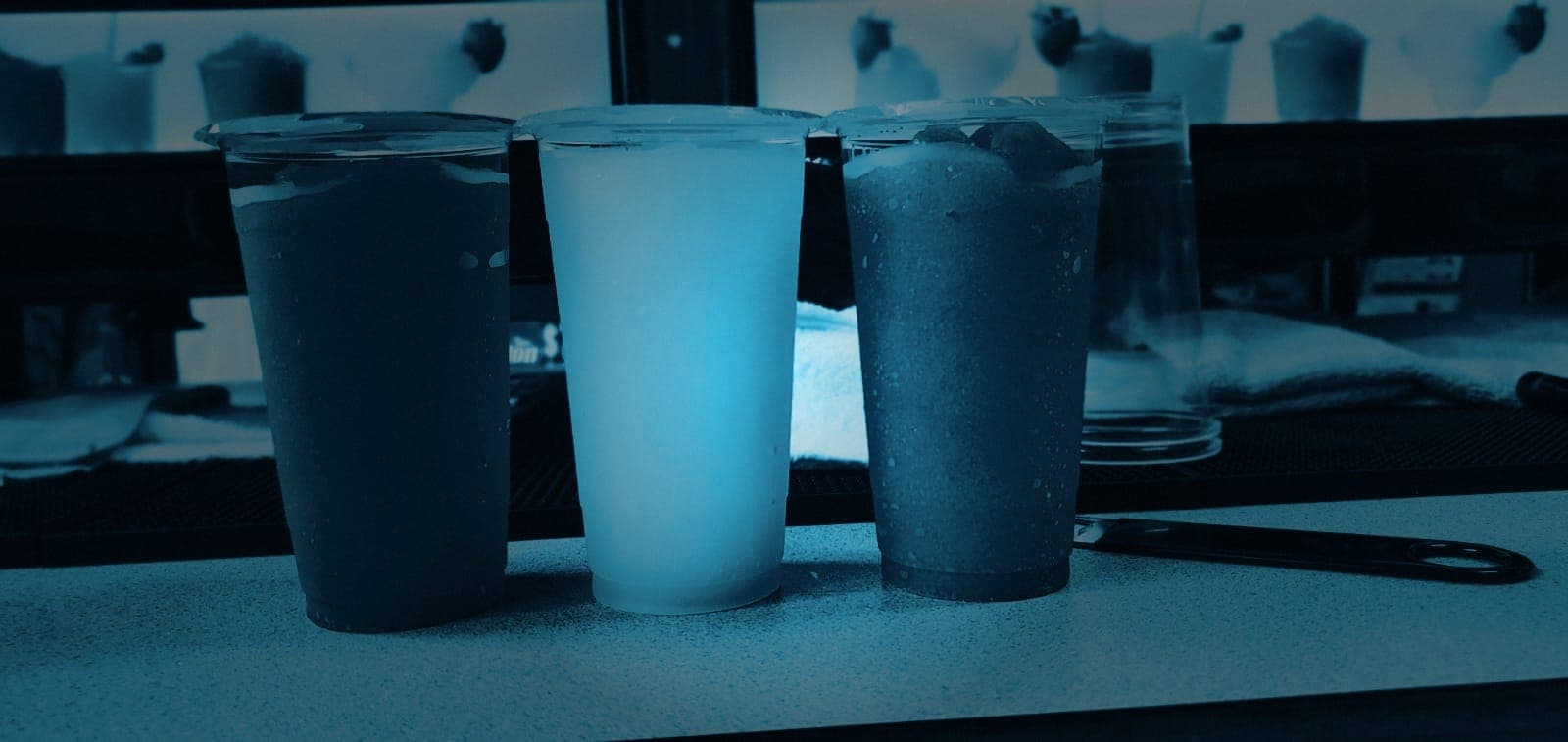Fresh beer slushies lined up on the counter
